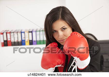 Businesswoman wearing boxing gloves View Large Photo Image Stock Image - Businesswoman wearing boxing gloves. Fotosearch
