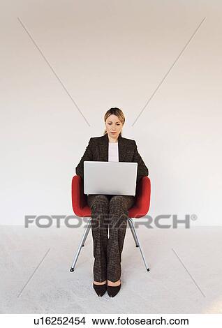 Businesswoman working on laptop View Large Photo Image Picture - Businesswoman working on laptop. Fotosearch