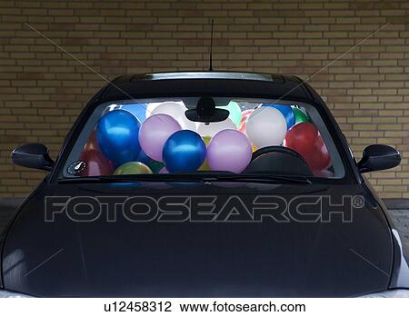 Car filled with colorful balloons View Large Photo Image Stock Image - Car filled with colorful balloons. Fotosearch