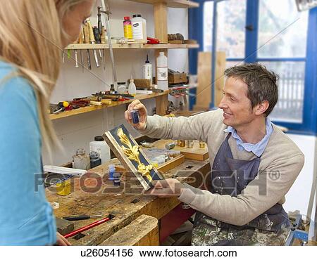 Carpenter matching pigment to paint View Large Photo Image Stock Photograph - Carpenter matching pigment to paint. Fotosearch