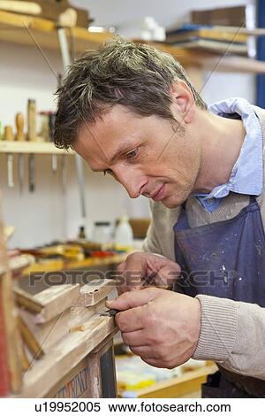 Carpenter working in shop View Large Photo Image Stock Photography - Carpenter working in shop. Fotosearch