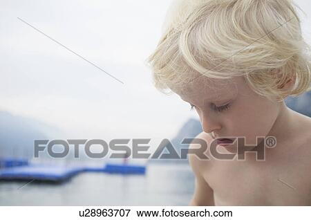 Close up of boys face on beach View Large Photo Image Stock Photo - Close up of boys face on beach. Fotosearch