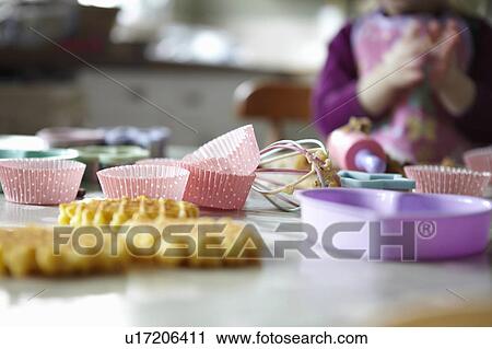 Close up of cupcake wrappers in kitchen View Large Photo Image Stock Image - Close up of cupcake wrappers in kitchen. Fotosearch