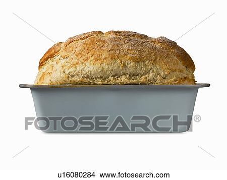 Close up of freshly baked bread in pan View Large Photo Image Picture - Close up of freshly baked bread in pan. Fotosearch