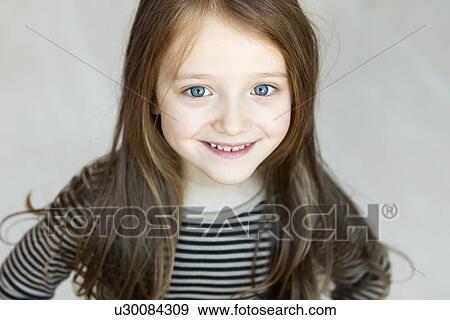 Stock Photo - Close up of girls smiling face. Fotosearch