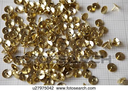 Close up of gold thumbtacks View Large Photo Image Stock Image - Close up of gold thumbtacks. Fotosearch