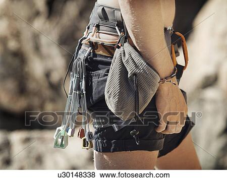 Stock Photo - Close up of rock climbers belt. Fotosearch