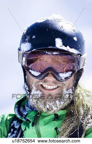 Picture - Close up of skiers snow-covered face. Fotosearch