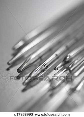 Stock Image - Close up of tips of pipettes. Fotosearch