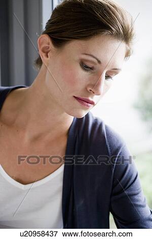 Close up of woman leaning on window View Large Photo Image Stock Photo - Close up of woman leaning on window. Fotosearch