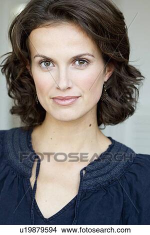 Picture - Close up of womans smiling face. Fotosearch