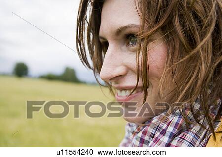 Close up of womans smiling face View Large Photo Image Stock Image - Close up of womans smiling face. Fotosearch