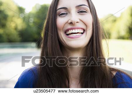 Close up of womans smiling face View Large Photo Image Stock Photo - Close up of womans smiling face. Fotosearch