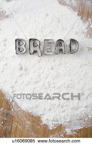 Cookie cutters spelling bread in flour View Large Photo Image Stock Photography - Cookie cutters spelling bread in flour. Fotosearch
