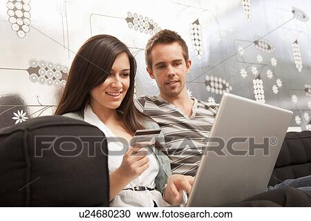 Couple shopping online together View Large Photo Image Stock Image - Couple shopping online together. Fotosearch