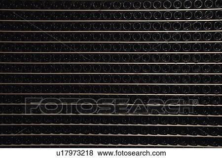 Empty bottles of wine in rack View Large Photo Image Stock Photo - Empty bottles of wine in rack. Fotosearch