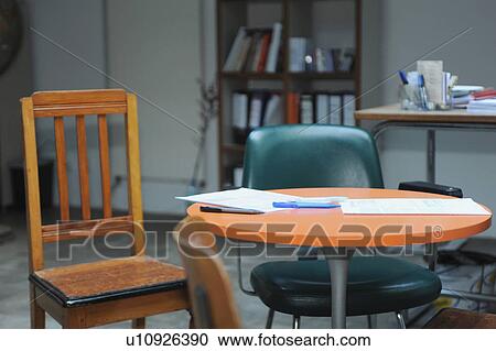Empty desk and chairs in office View Large Photo Image Stock Image - Empty desk and chairs in office. Fotosearch