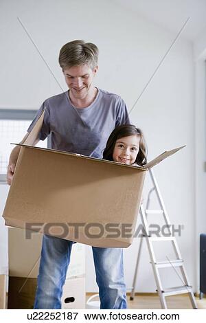 Father carrying daughter in box View Large Photo Image Stock Photo - Father carrying daughter in box. Fotosearch