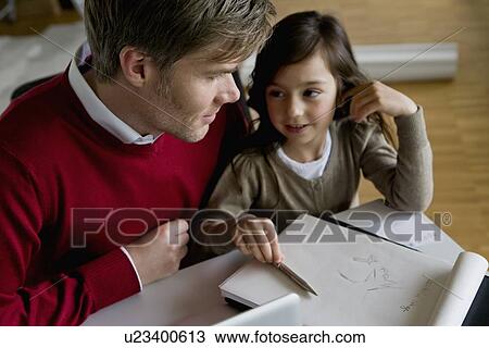 Father helping daughter with homework View Large Photo Image Stock Image - Father helping daughter with homework. Fotosearch