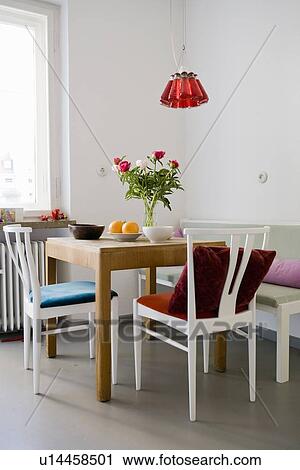 Stock Image - Fruit and flowers on table. Fotosearch