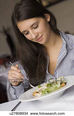 Girl having plate of food in cafe View Large Photo Image Picture - Girl having plate of food in cafe. Fotosearch