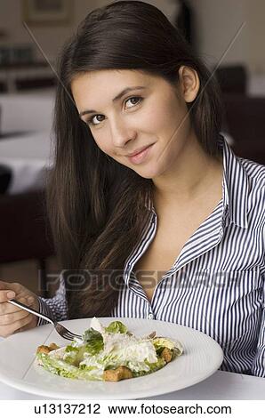 Girl having plate of food in cafe View Large Photo Image Stock Image - Girl having plate of food in cafe. Fotosearch