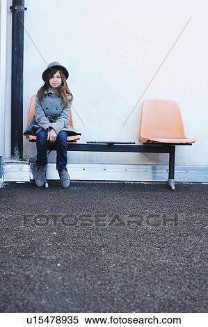 Girl sitting on chair outdoors View Large Photo Image Stock Photography - Girl sitting on chair outdoors. Fotosearch