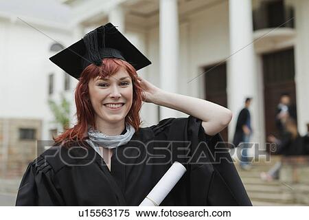 Graduate with her degree on campus View Large Photo Image Stock Photography - Graduate with her degree on campus. Fotosearch
