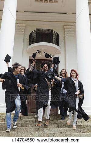 Graduates cheering on campus View Large Photo Image Stock Image - Graduates cheering on campus. Fotosearch