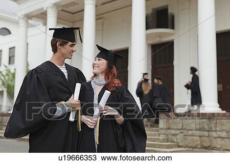 Graduates with their degrees on campus View Large Photo Image Stock Image - Graduates with their degrees on campus. Fotosearch