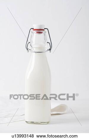 Jar of milk on table View Large Photo Image Stock Photo - Jar of milk on table. Fotosearch