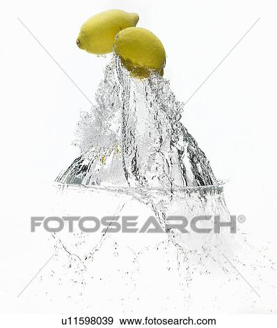 Lemons splashing in water View Large Photo Image Stock Photo - Lemons splashing in water. Fotosearch