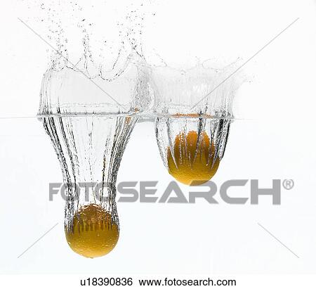 Lemons splashing in water View Large Photo Image Stock Photograph - Lemons splashing in water. Fotosearch