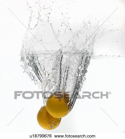Lemons splashing in water View Large Photo Image Stock Photograph - Lemons splashing in water. Fotosearch