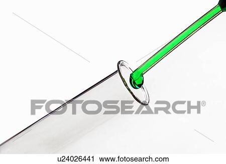Liquid dripping into test tube View Large Photo Image Stock Image - Liquid dripping into test tube. Fotosearch