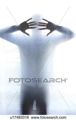 Man standing behind thin screen View Large Photo Image Stock Photograph - Man standing behind thin screen. Fotosearch