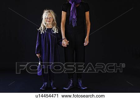 Stock Image - Mother and daughter holding hands. Fotosearch