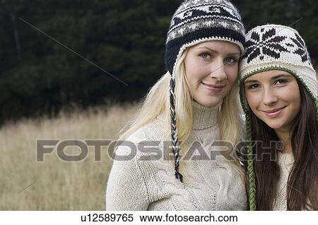 Mother and daughter standing together View Large Photo Image Stock Photography - Mother and daughter standing together. Fotosearch