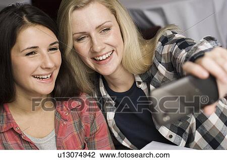 Mother and daughter taking picture View Large Photo Image Stock Image - Mother and daughter taking picture. Fotosearch