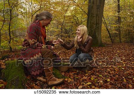 Mother and daughter talking in forest View Large Photo Image Stock Photography - Mother and daughter talking in forest. Fotosearch