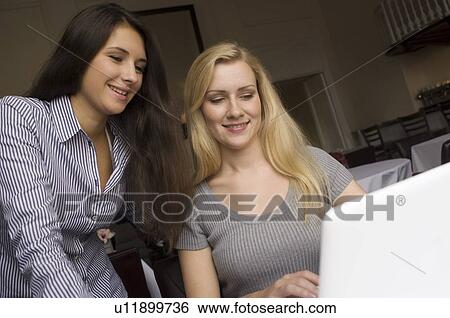 Mother and daughter using laptop View Large Photo Image Stock Photograph - Mother and daughter using laptop. Fotosearch