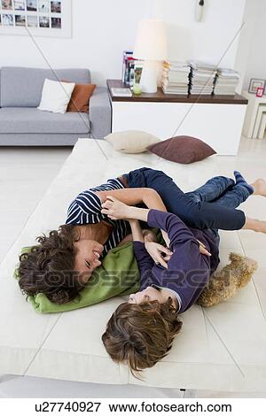 Mother and son relaxing in living room View Large Photo Image Stock Photo - Mother and son relaxing in living room. Fotosearch