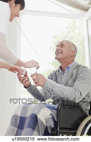 Nurse giving older patient medication View Large Photo Image Stock Photography - Nurse giving older patient medication. Fotosearch