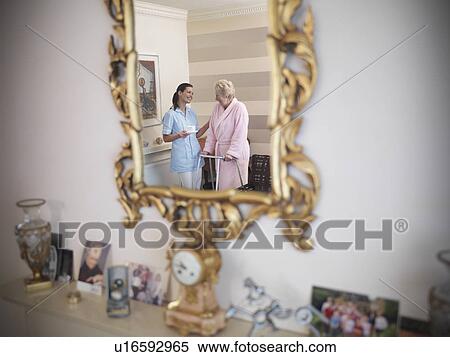 Nurse talking to older woman in house View Large Photo Image Stock Photography - Nurse talking to older woman in house. Fotosearch