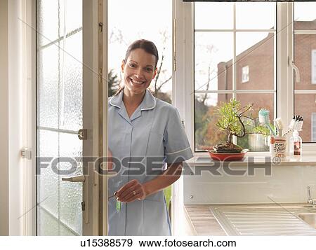 Nurse walking in front door View Large Photo Image Stock Photo - Nurse walking in front door. Fotosearch