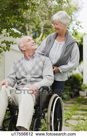 Nurse wheeling older patient outdoors View Large Photo Image Stock Image - Nurse wheeling older patient outdoors. Fotosearch