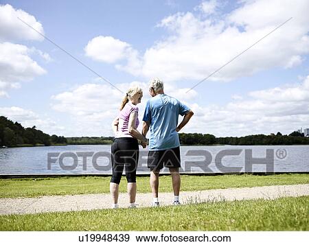 Older couple holding hands outdoors View Large Photo Image Stock Photo - Older couple holding hands outdoors. Fotosearch
