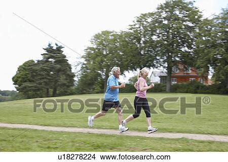 Older couple jogging together outdoors View Large Photo Image Picture - Older couple jogging together outdoors. Fotosearch