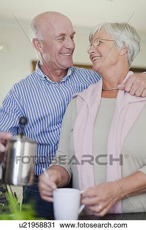 Older couple making coffee together View Large Photo Image Stock Image - Older couple making coffee together. Fotosearch