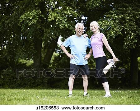 Older couple stretching in park View Large Photo Image Stock Image - Older couple stretching in park. Fotosearch